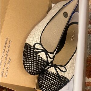 Rothy's Black and Cream Ballet Flats with Bow Detail